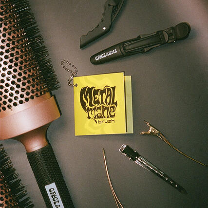 Printed brush tag with Metal Mane collection.